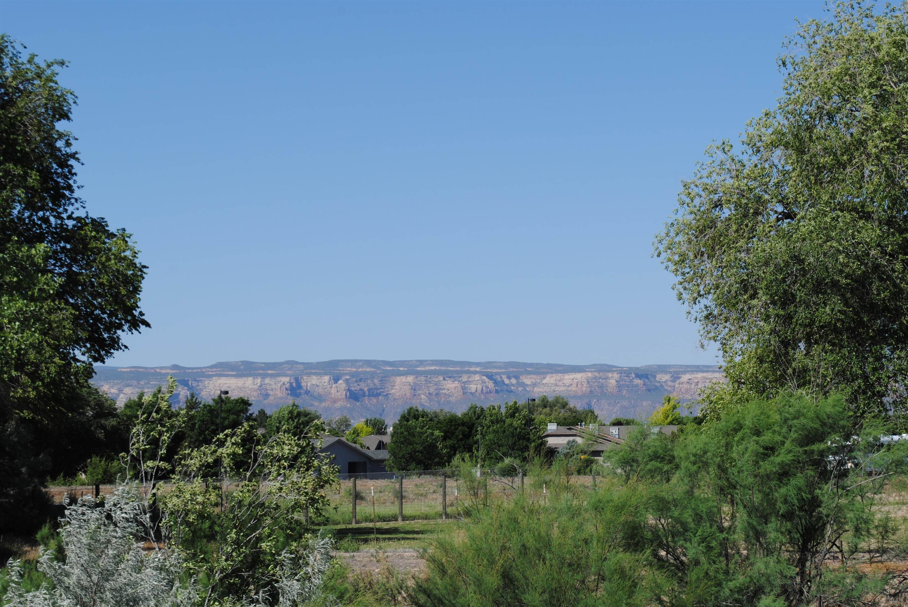 Lot 4 Maroon Creek Loop Grand Junction, CO 81505 - Photo 14 of 20 a view of a building in the middle of a garden