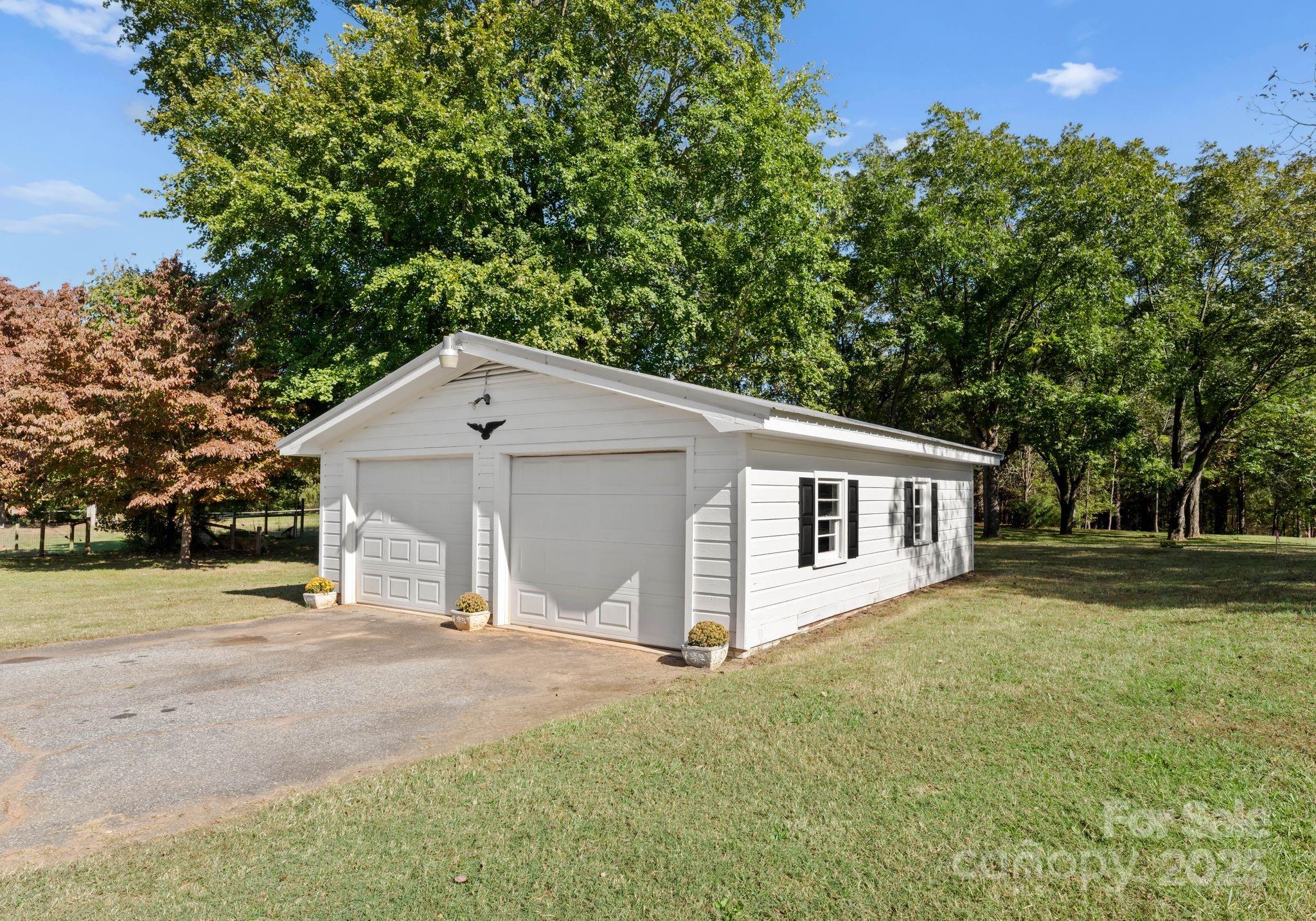 5170 Woodleaf Road Salisbury, NC 28147 - Photo 11 of 13 a house with trees in the background