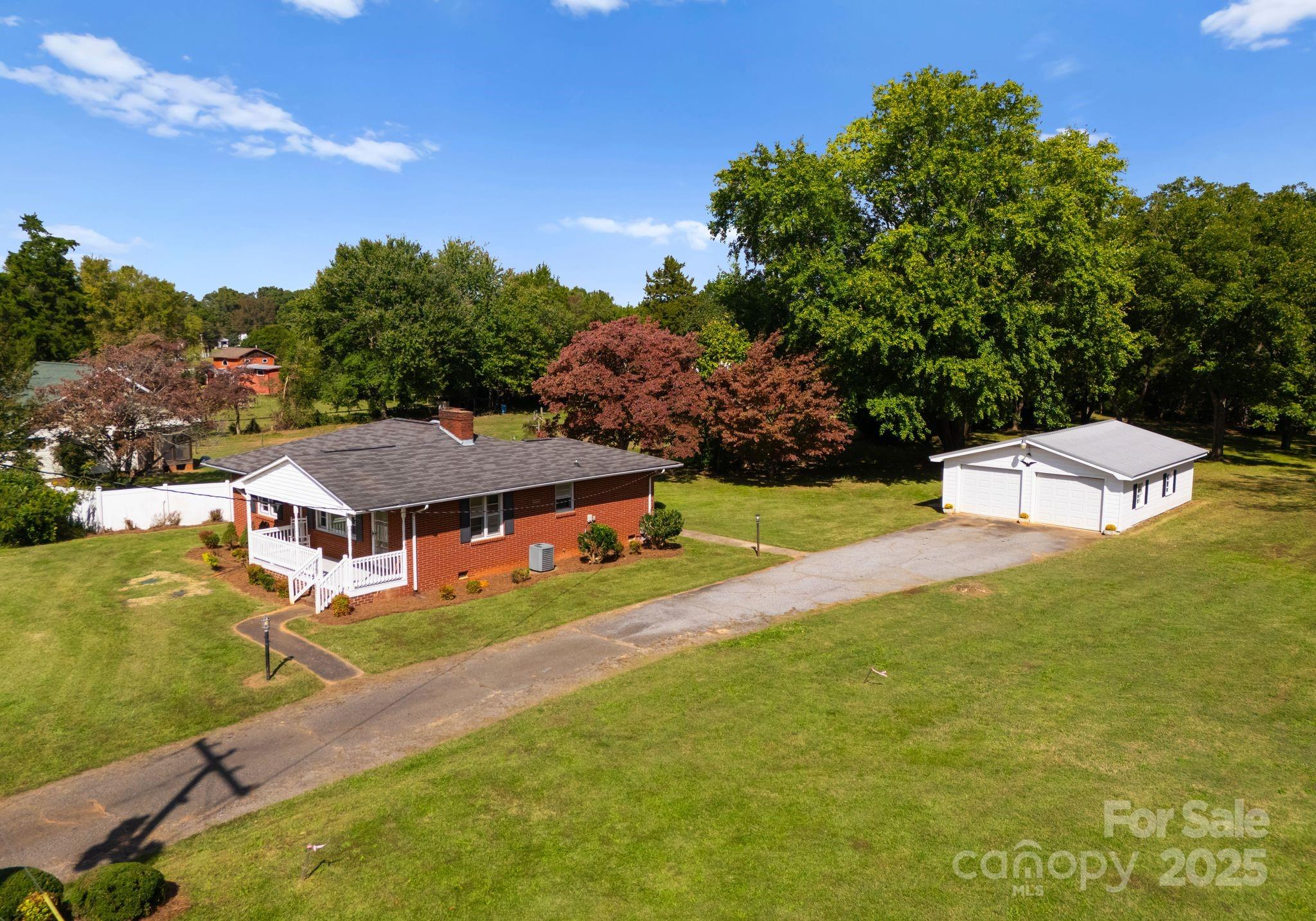 5170 Woodleaf Road Salisbury, NC 28147 - Photo 13 of 13 an aerial view of a house with swimming pool garden and mountain view