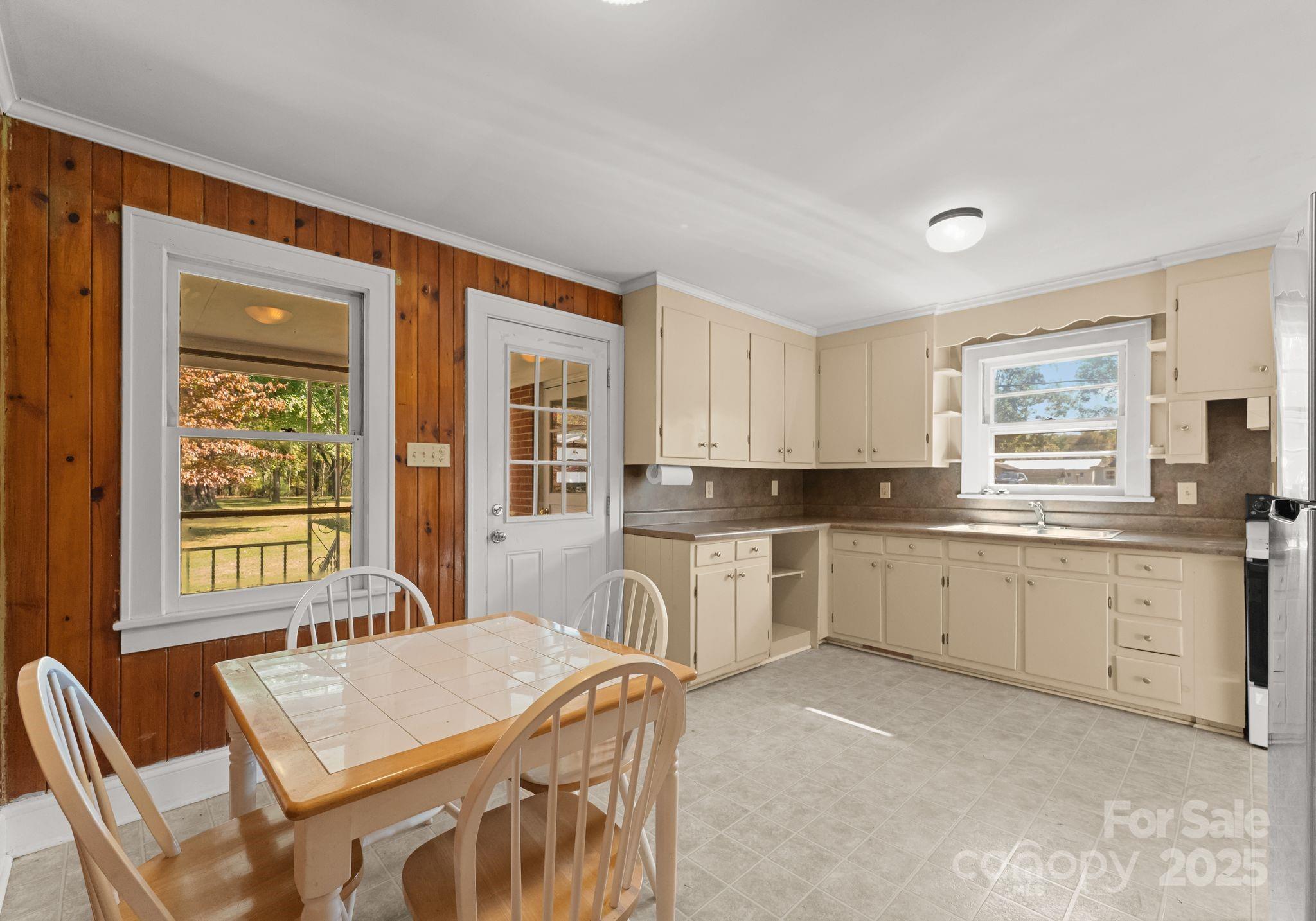 5170 Woodleaf Road Salisbury, NC 28147 - Photo 5 of 13 a large kitchen with granite countertop lots of counter space and windows
