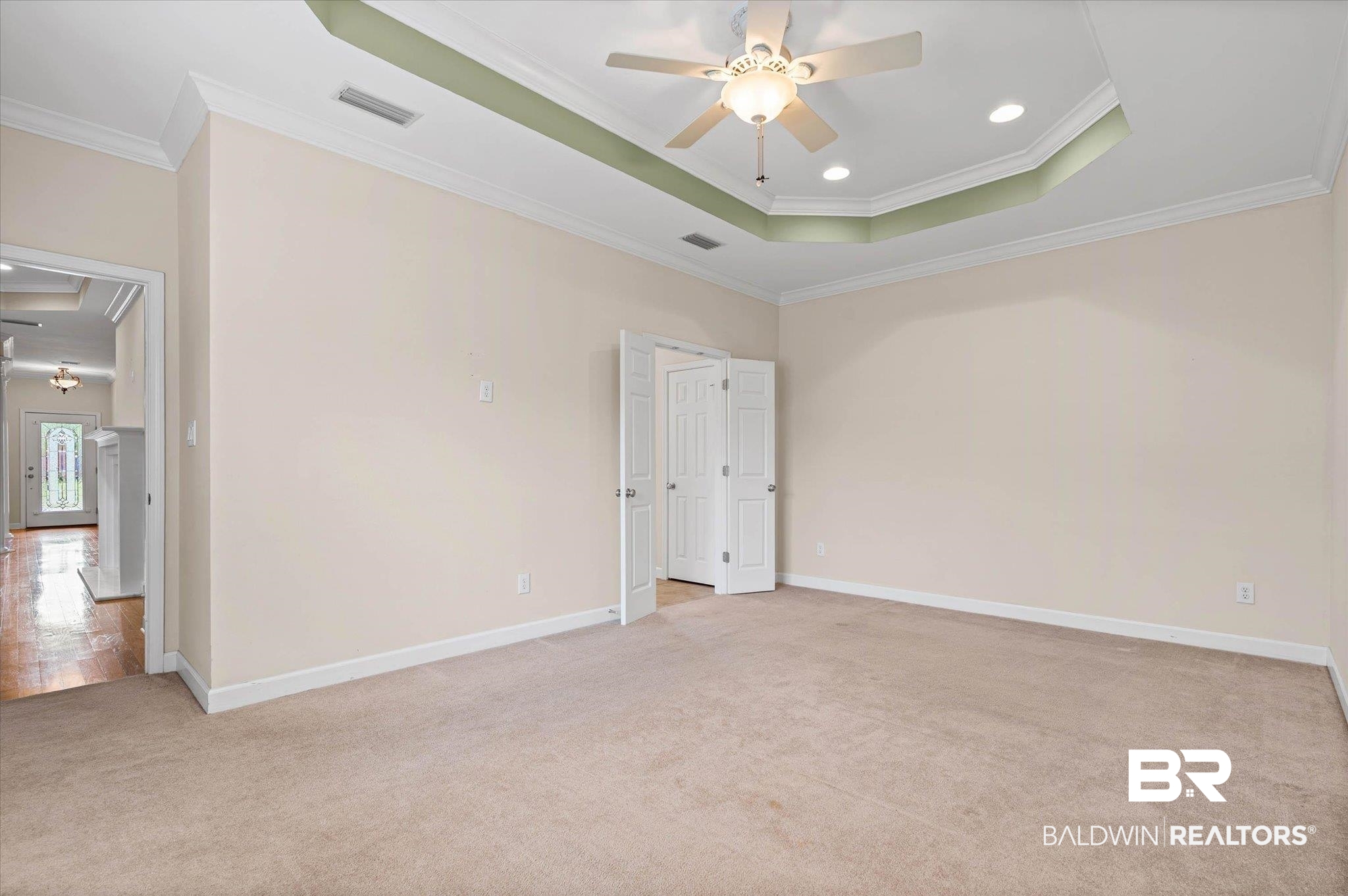 1003 Weatherby Street South Saraland, AL 36571 - Photo 22 of 31 Unfurnished bedroom featuring a raised ceiling, crown molding, light carpet, recessed lighting, and a ceiling fan
