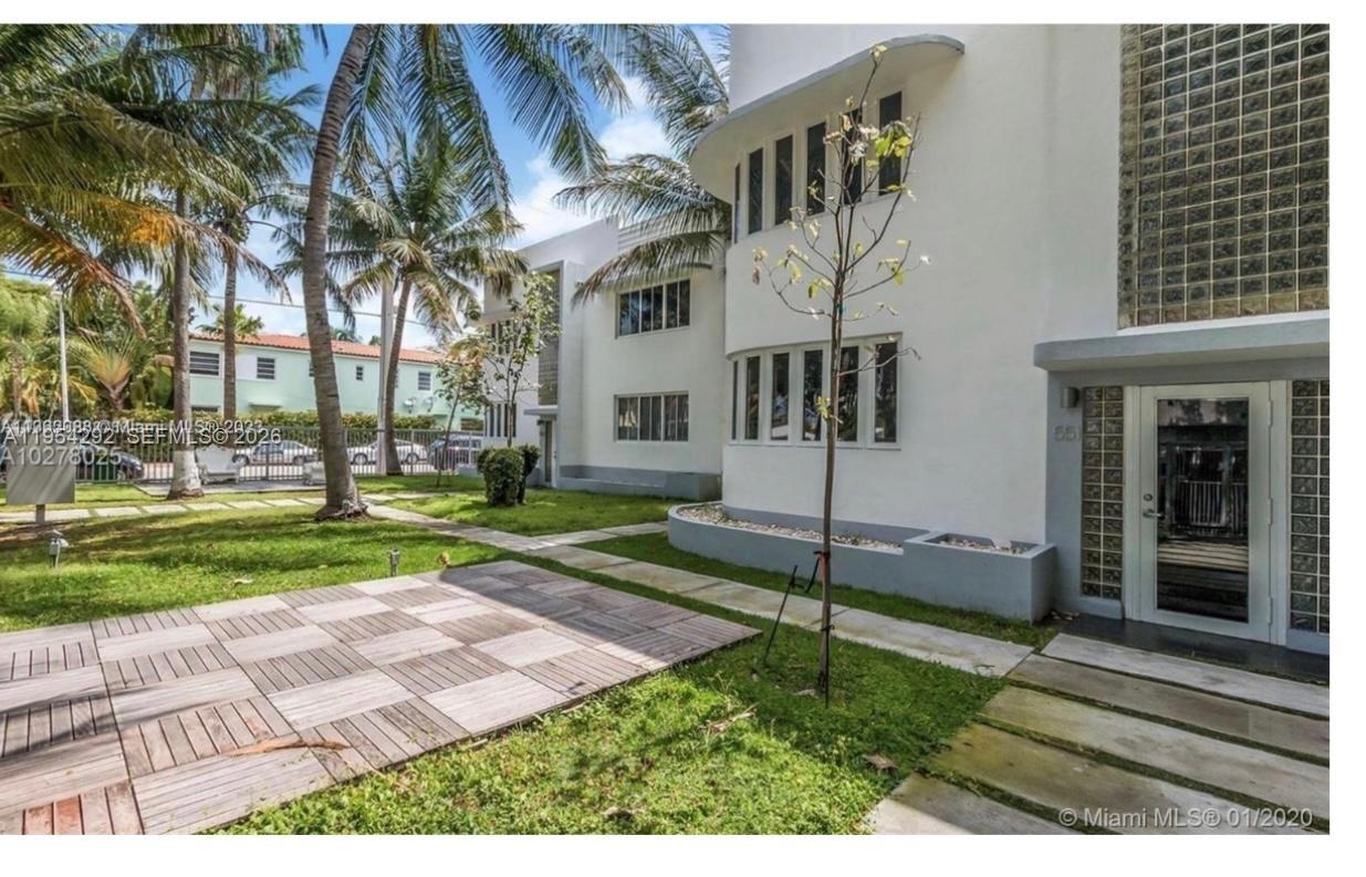 557 Michigan Avenue, Unit 111 Miami Beach, FL 33139 - Photo 2 of 13 a view of a house with a yard