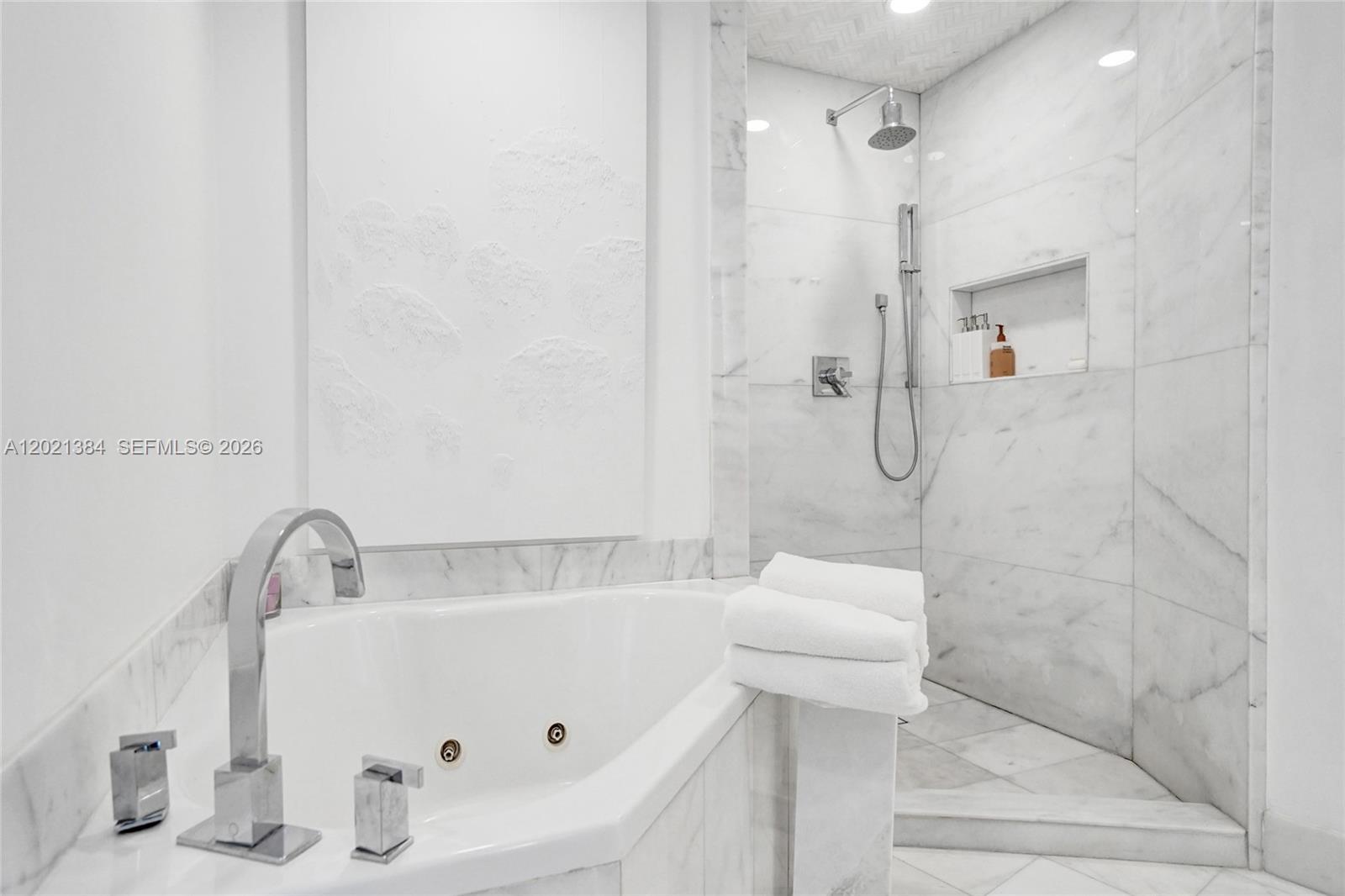 400 Alton Road, Unit PH11 Miami Beach, FL 33139 - Photo 32 of 49 a bathroom with a tub and a shower