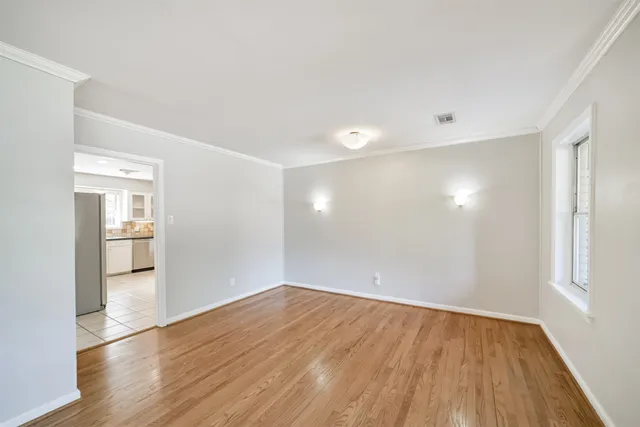a bathroom with a sink toilet and a mirror