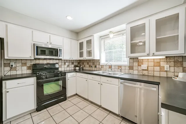 a view of backyard with green space