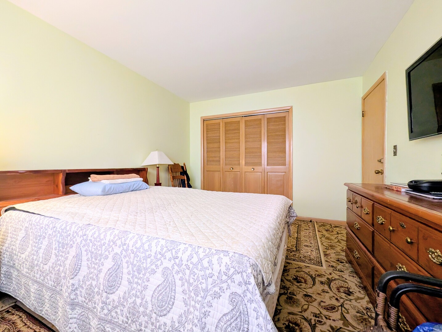 4229 North Keystone Avenue, Unit 3H Chicago, IL 60641 - Photo 18 of 22 a bedroom with a bed and wooden floor