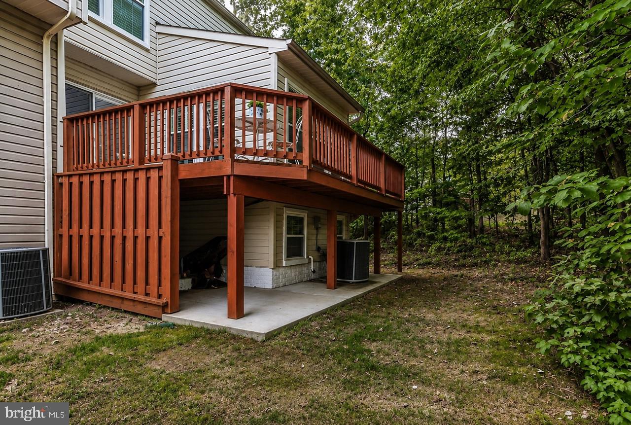 8616 Fire Rock Road Laurel, MD 20724 - Photo 20 of 24 Charming deck nestled in nature's embrace.