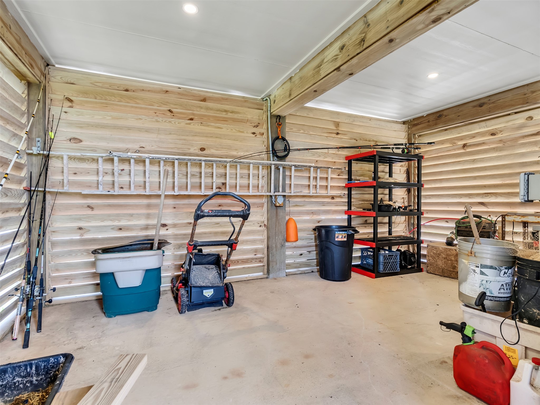 1453 County Road 230 Sargent, TX 77414 - Photo 25 of 38 Discover the perfect solution for your storage needs in this spacious, well-organized area under the home, offering ample room for all your essentials