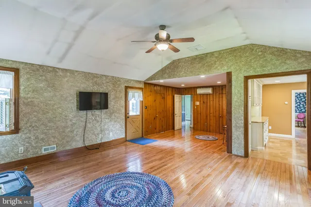 a view of livingroom with hardwood floor and ceiling fan