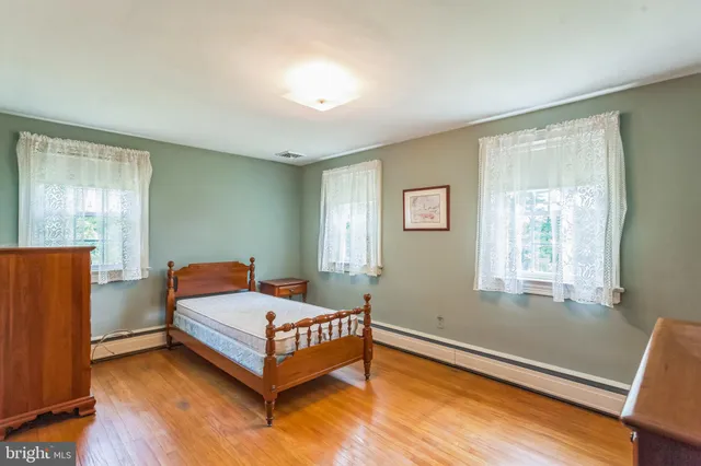 a room with a bed and a window