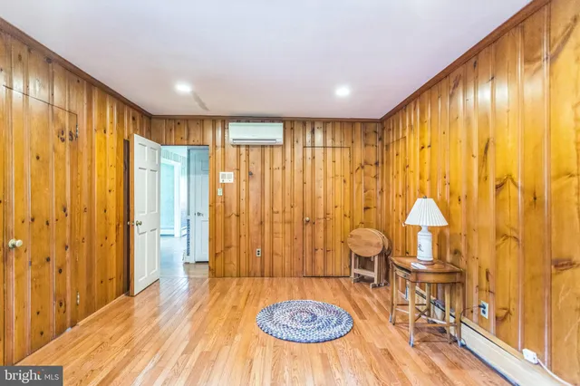 a view of a livingroom with furniture wooden floor and window