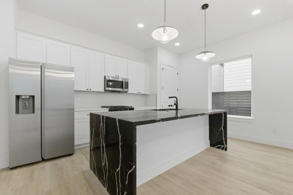 6539 Sealey Street Houston, TX 77091 - Photo 14 of 28 a kitchen with stainless steel appliances granite countertop a refrigerator a sink dishwasher a stove and a refrigerator