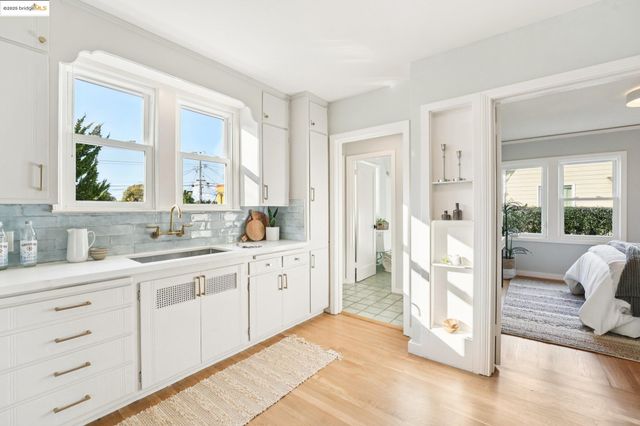 a spacious bathroom with a double vanity sink and a mirror