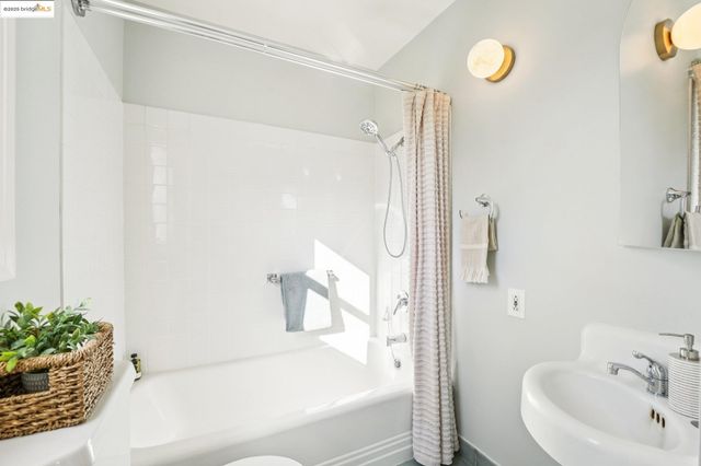 a bathroom with a bathtub and a sink