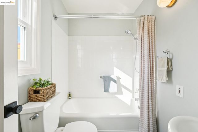 a bathroom with a tub and shower