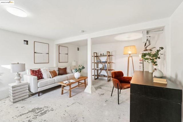 a living room with furniture and flowers