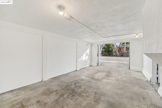 an empty room with a empty space and windows