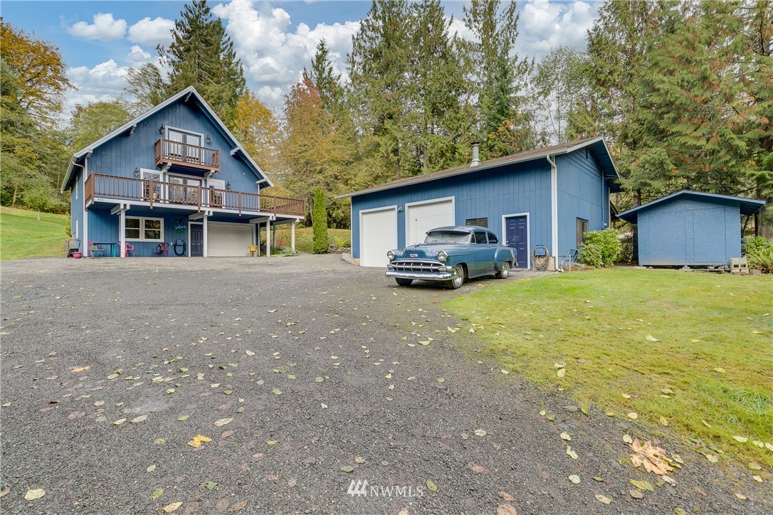 410 Northwest Lake Roesiger Road Snohomish, WA 98290 - Photo 1 of 1 a front view of house with yard and car parked