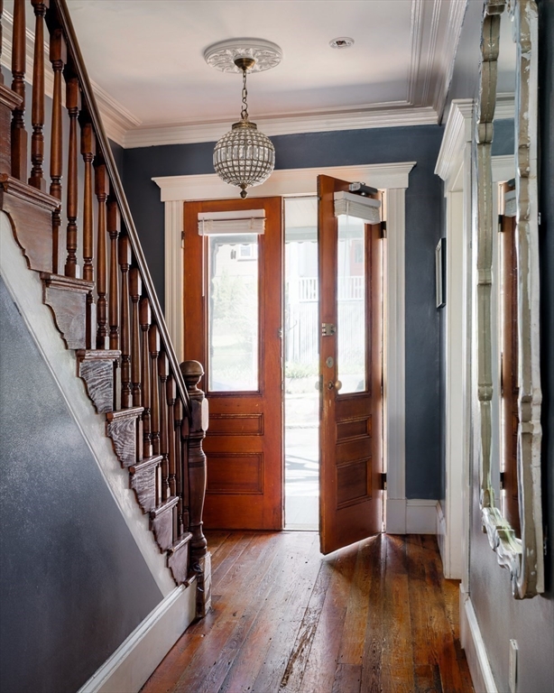 70 Oxford Street Somerville, MA 02143 - Photo 17 of 38 a view of a hallway with wooden floor and staircase