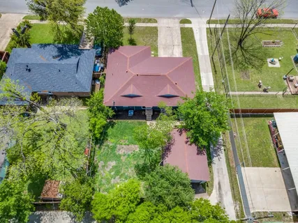 an aerial view of a house with a garden