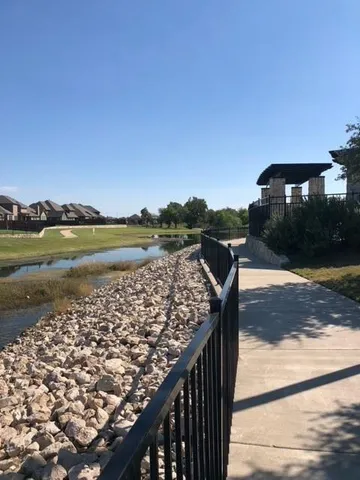 a view of swimming pool from a balcony