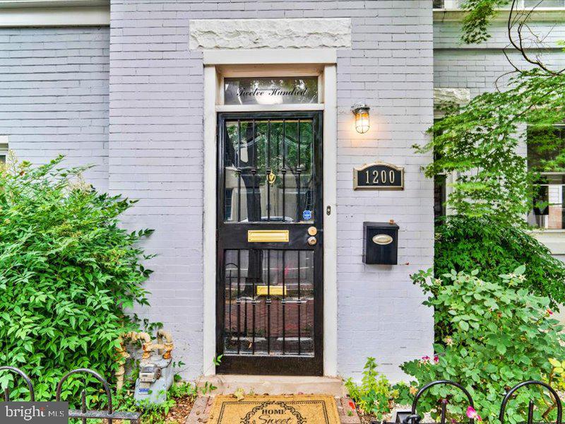 1200 D Street Northeast Washington, DC 20002 - Photo 45 of 47 Charming entrance with lush greenery.