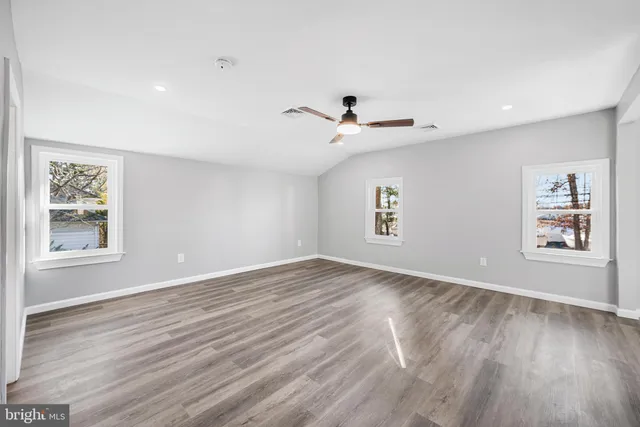 a view of room with hardwood floor and window
