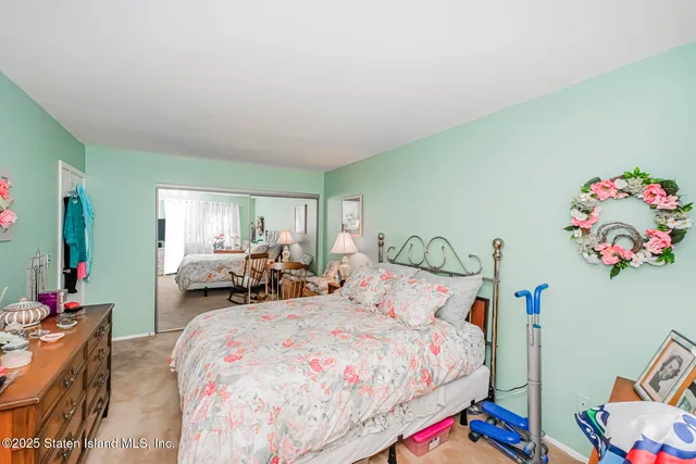 a bedroom with bed and a couch