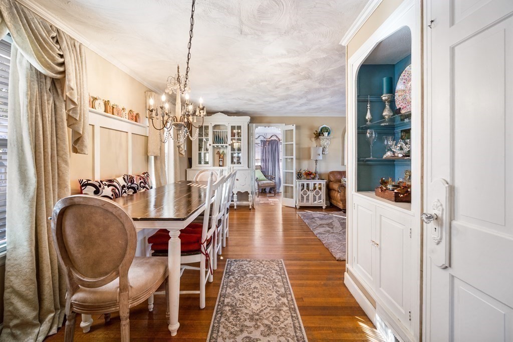 5 Mayfield Street Springfield, MA 01108 - Photo 12 of 30 a dining room with furniture a chandelier and wooden floor