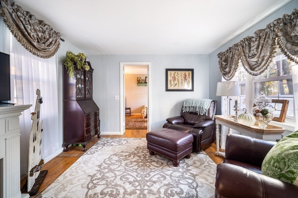 5 Mayfield Street Springfield, MA 01108 - Photo 18 of 30 a living room with furniture and a flat screen tv