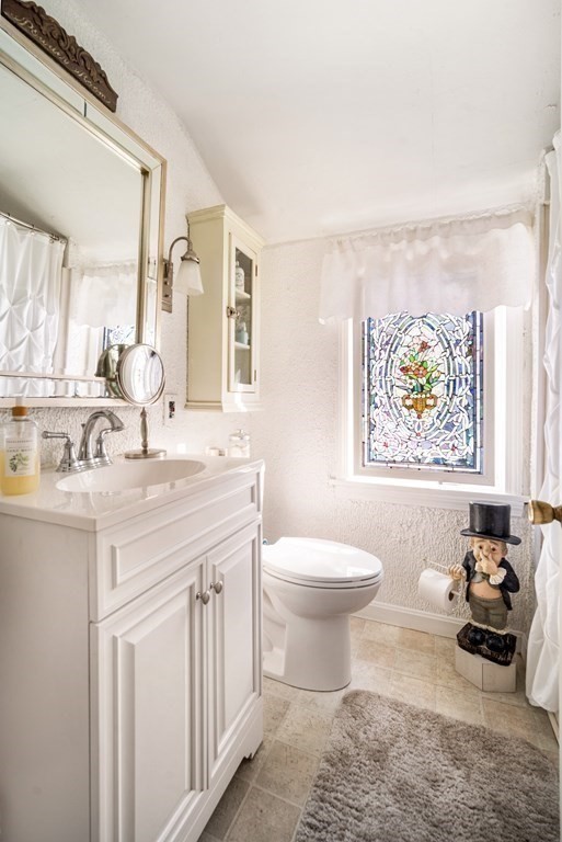 5 Mayfield Street Springfield, MA 01108 - Photo 24 of 30 a bathroom with a sink a toilet and a window