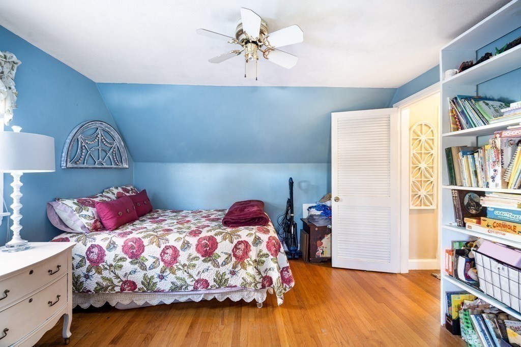 5 Mayfield Street Springfield, MA 01108 - Photo 26 of 30 a bedroom with bed and a book shelf