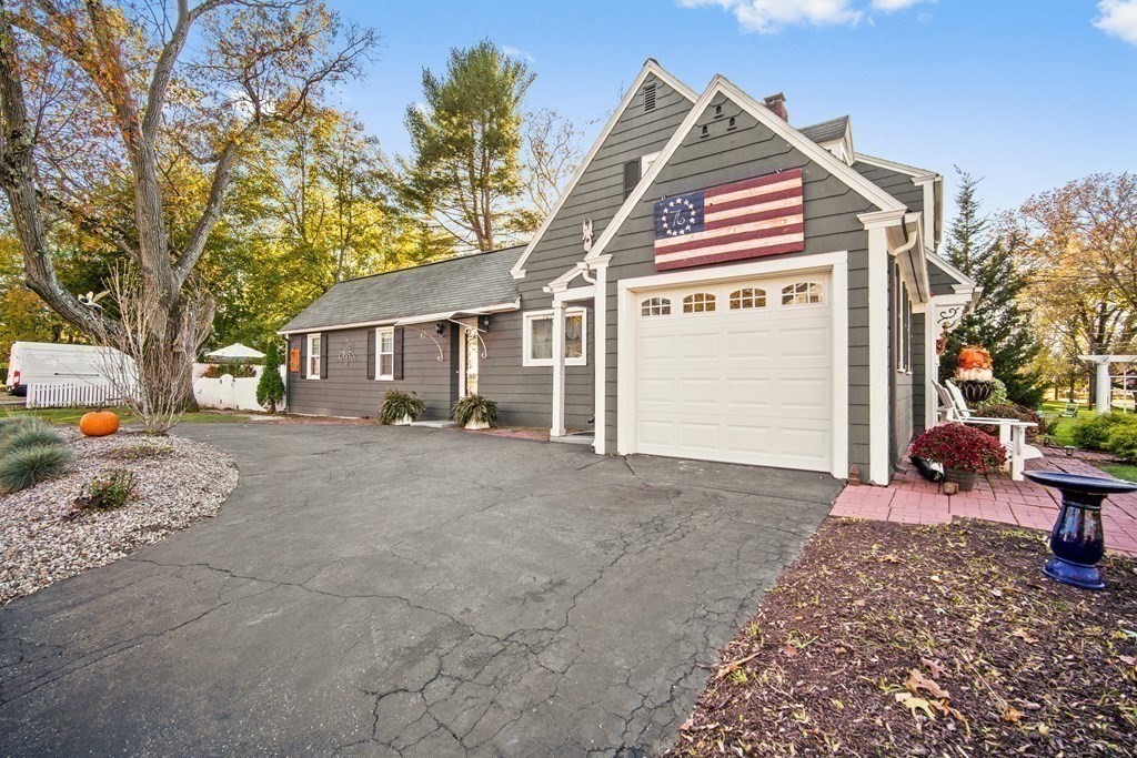 5 Mayfield Street Springfield, MA 01108 - Photo 3 of 30 a front view of a house with a yard and garage