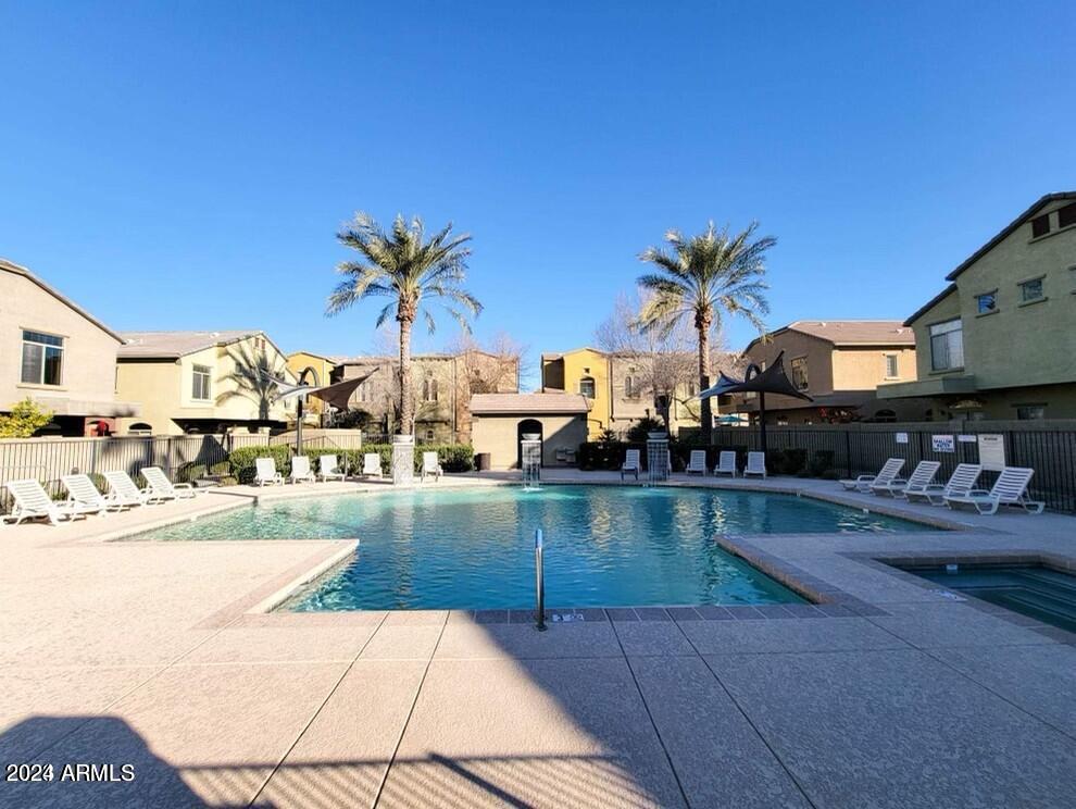 2150 West Alameda Road, Unit 1169 Phoenix, AZ 85085 - Photo 2 of 26 a view of a swimming pool and a couch