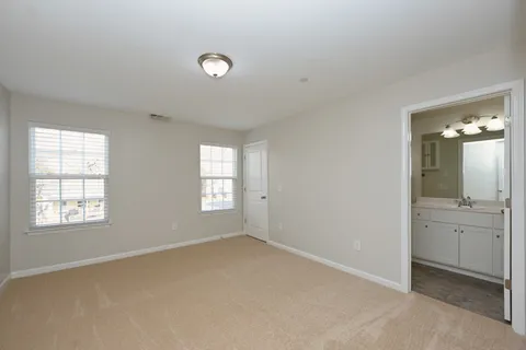 a view of entryway and gallery with wooden floor