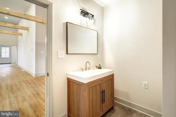 a bathroom with a sink and a mirror