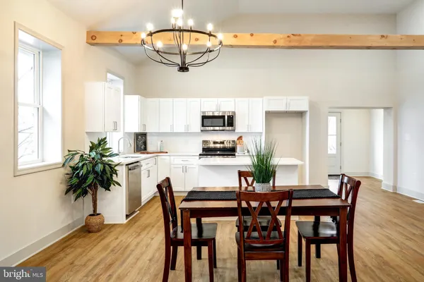a view of a dining room with furniture window and wooden floor