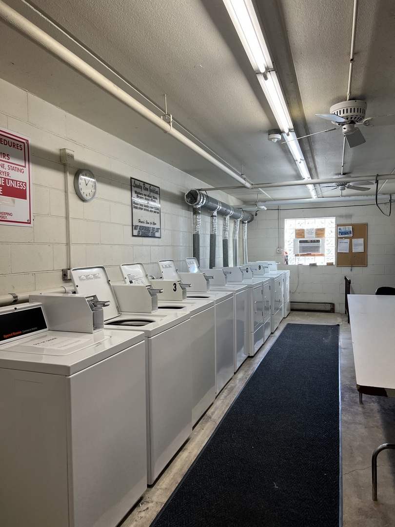 835 Pearson Street, Unit 209 Des Plaines, IL 60016 - Photo 10 of 10 a bathroom with double vanity sinks a mirror and a shower