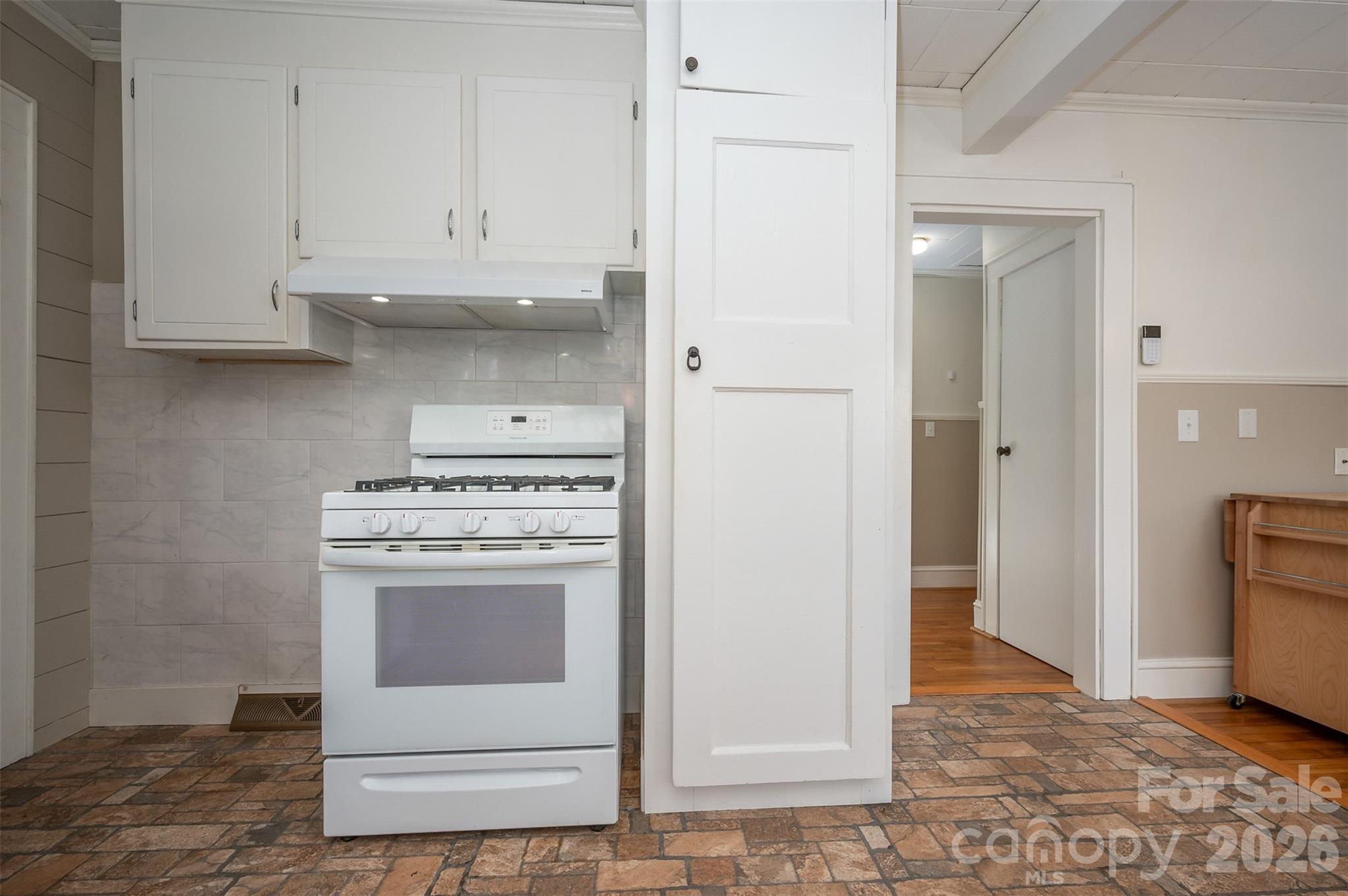 351 Waters Road Bostic, NC 28018 - Photo 11 of 35 a kitchen with white cabinets and white appliances