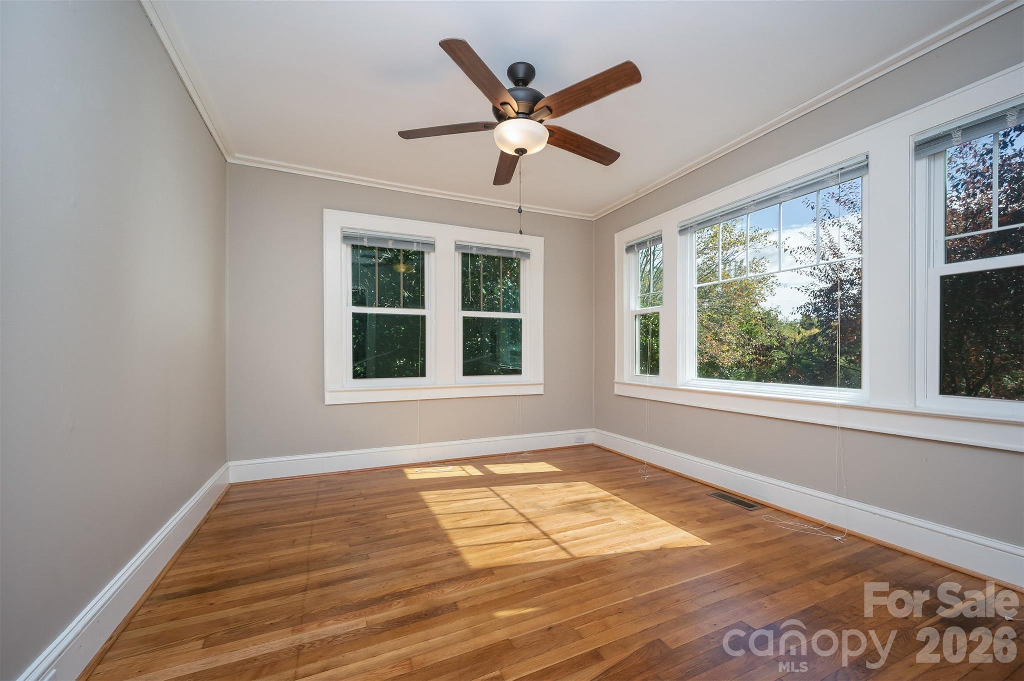 351 Waters Road Bostic, NC 28018 - Photo 16 of 35 a view of an empty room with wooden floor and a window
