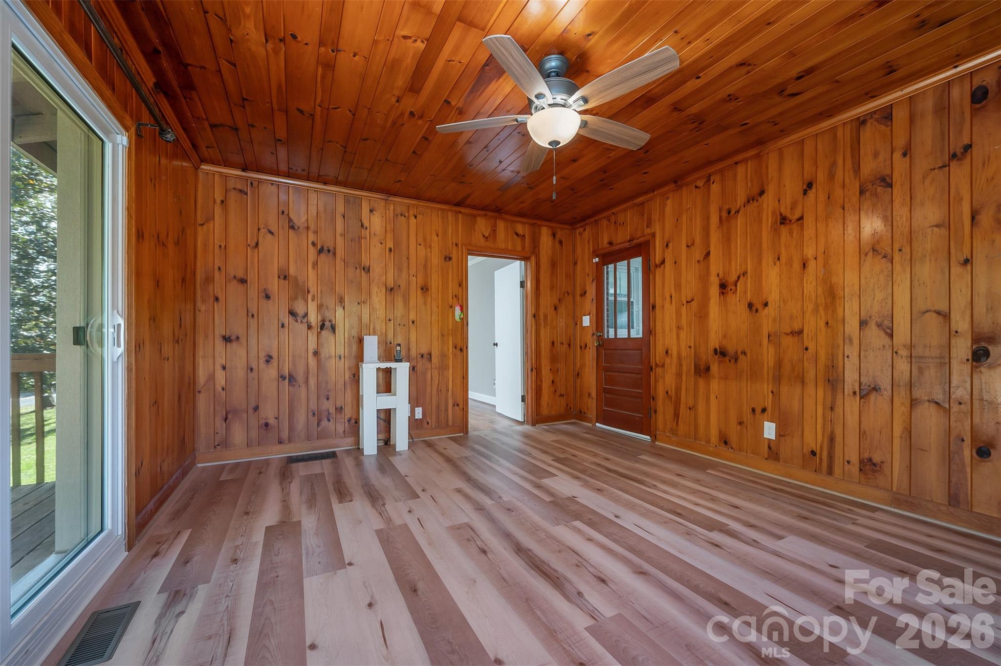 351 Waters Road Bostic, NC 28018 - Photo 20 of 35 a view of an empty room with wooden floor and a window