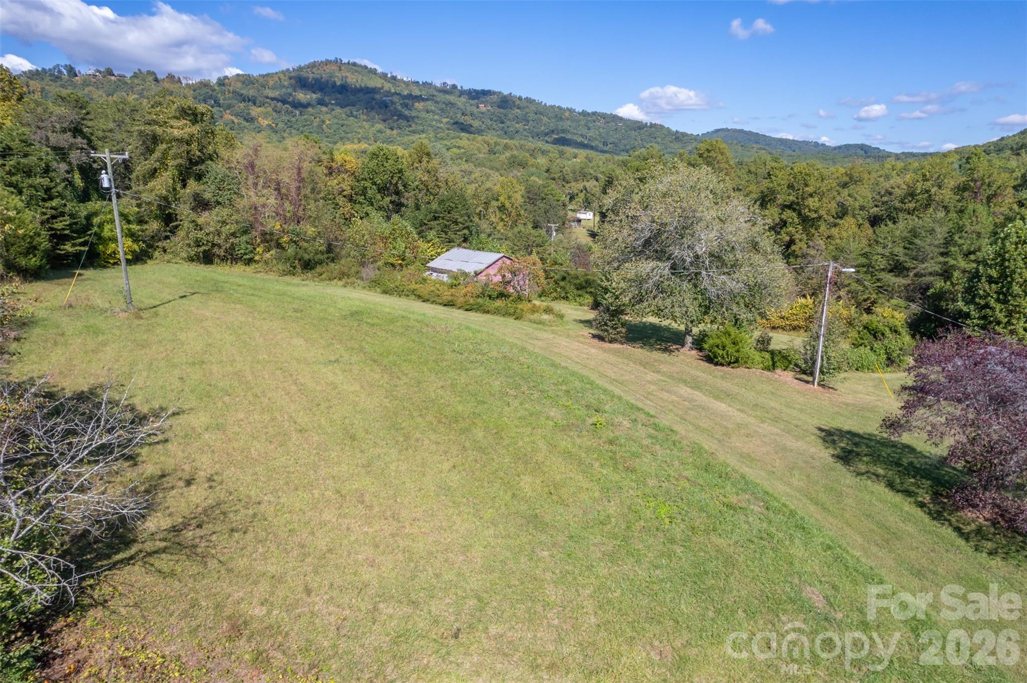351 Waters Road Bostic, NC 28018 - Photo 34 of 35 a view of a lush green hillside and houses
