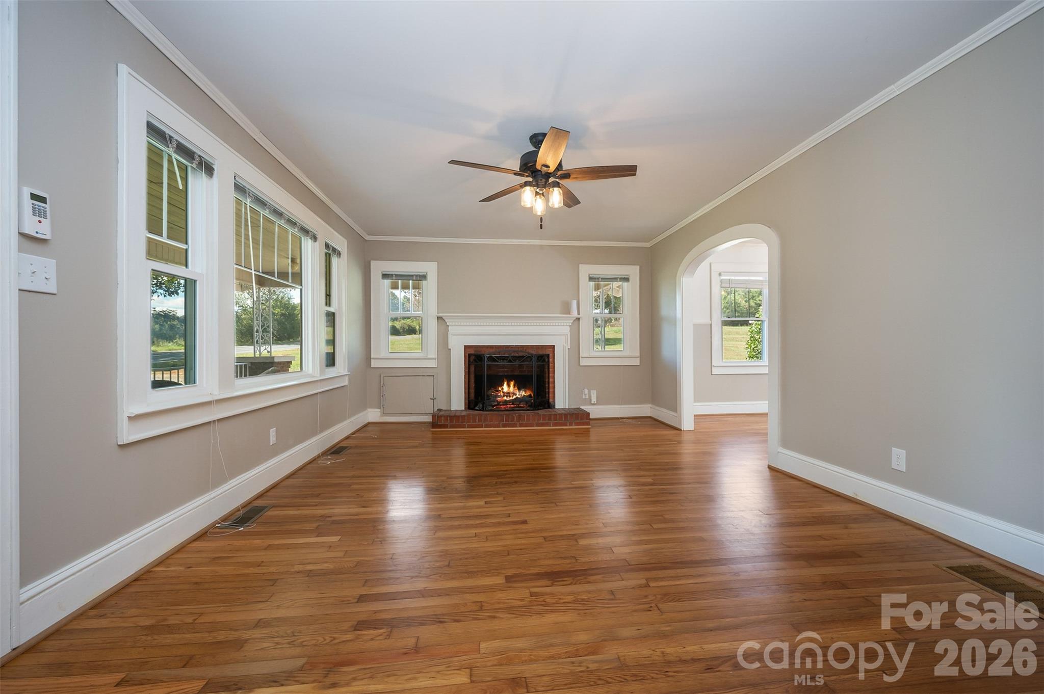 351 Waters Road Bostic, NC 28018 - Photo 5 of 35 a view of empty room with fireplace and wooden floor