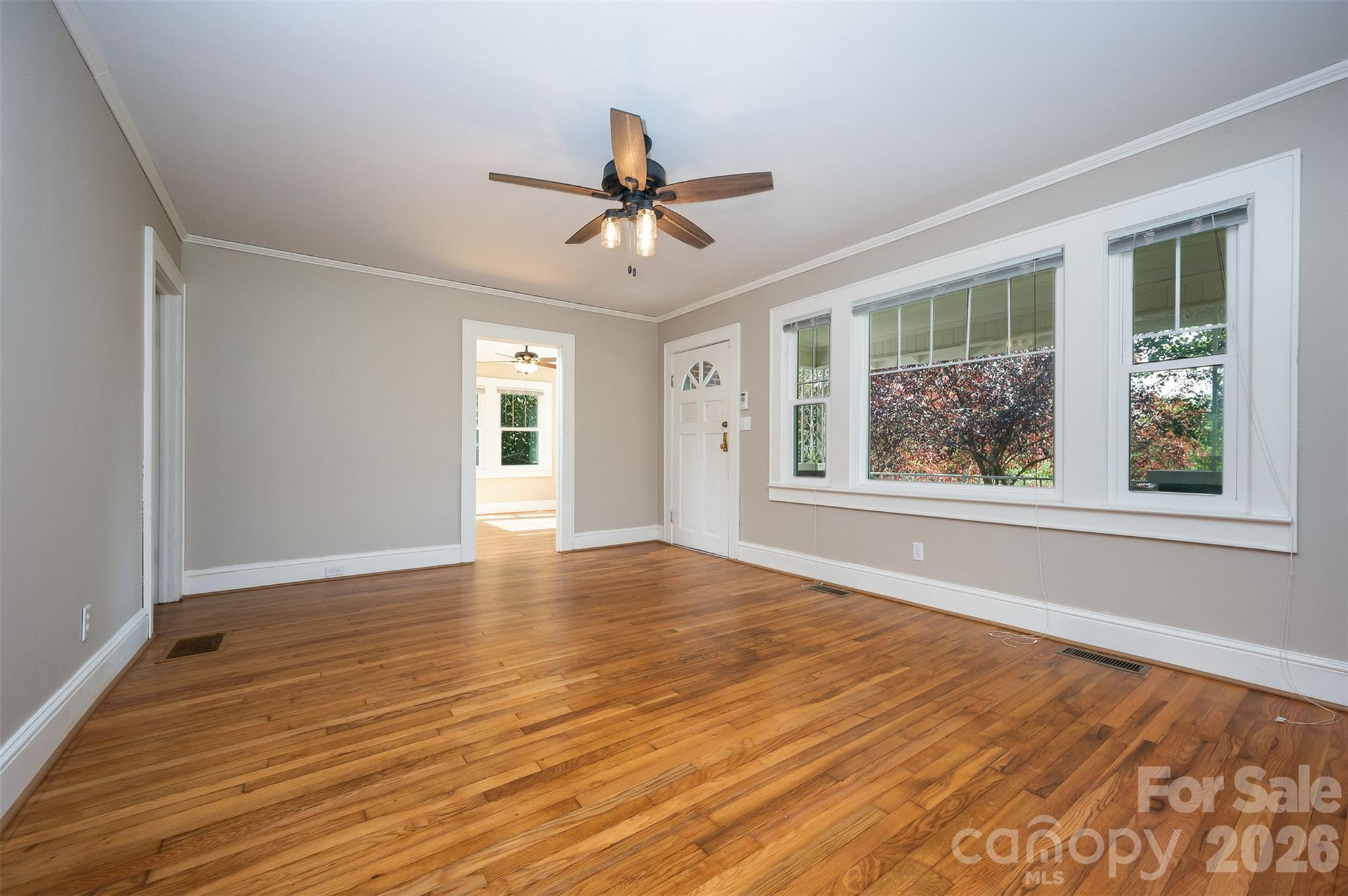 351 Waters Road Bostic, NC 28018 - Photo 6 of 35 a view of an empty room with wooden floor and a window
