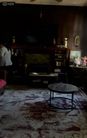 a view of a livingroom with furniture and windows