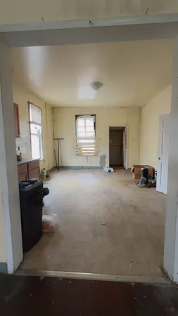 a stove top oven sitting inside of a kitchen