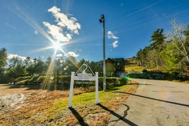 a view of a porch with a table and chairs