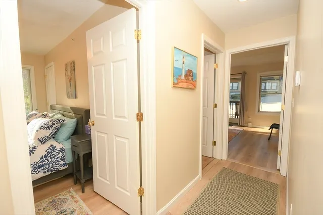 a view of a livingroom with wooden floor and a cabinet