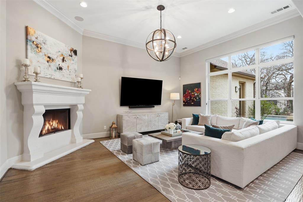 6714 Williamson Road Dallas, TX 75214 - Photo 11 of 40 a living room with furniture a flat screen tv and a fireplace