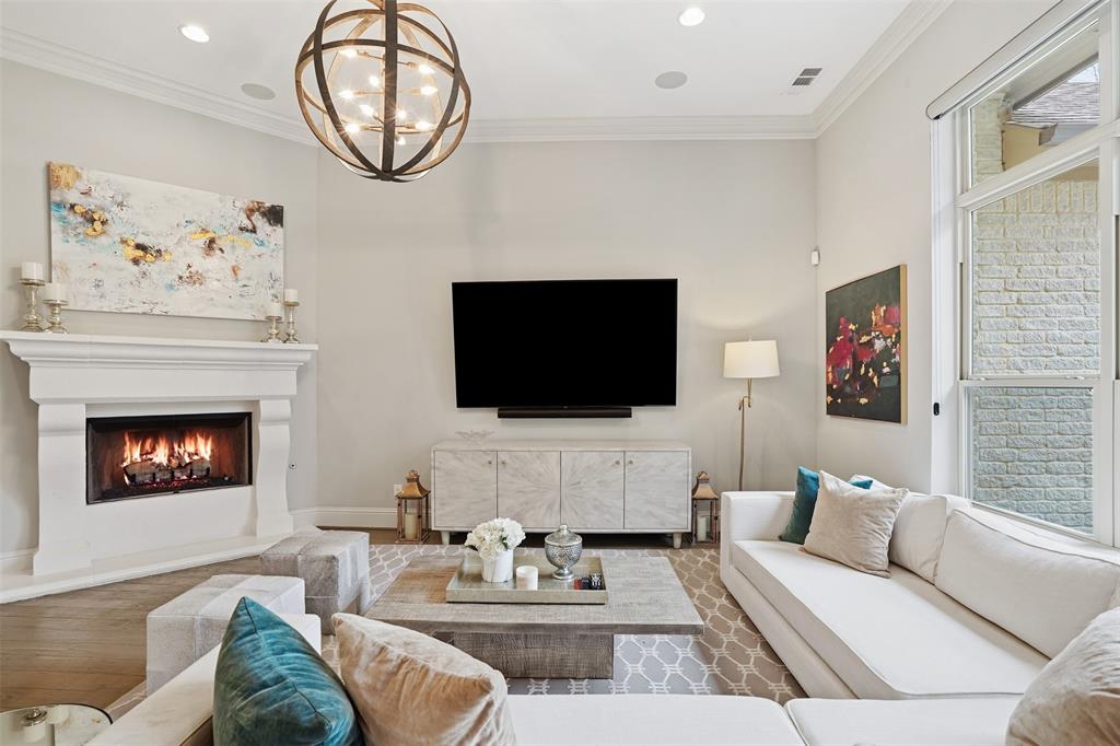 6714 Williamson Road Dallas, TX 75214 - Photo 12 of 40 a living room with furniture a flat screen tv and a fireplace